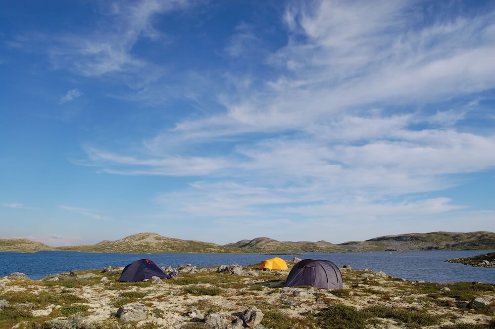 Camping tents in a coast with water