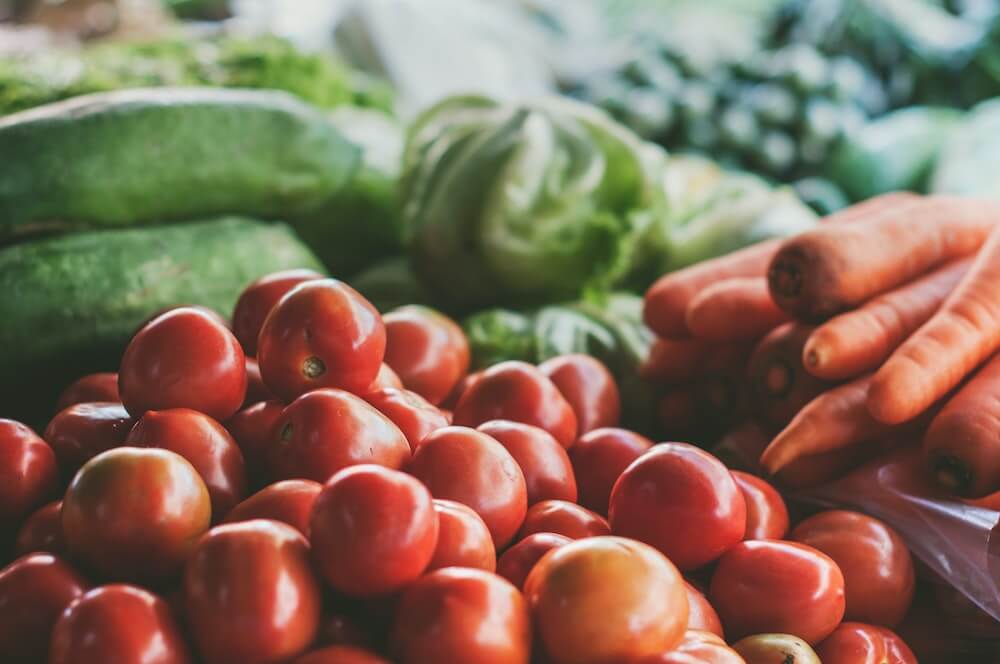 Produce including tomatoes and carrots